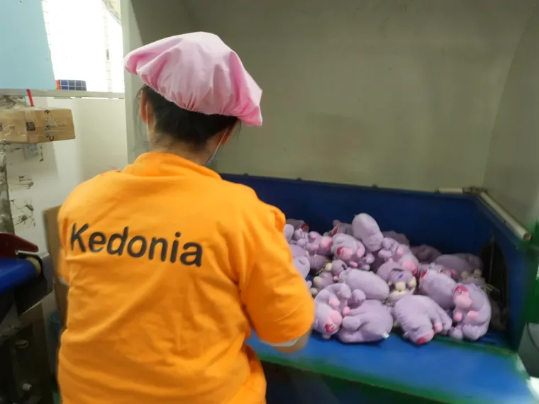 Plush toys being prepared on the packaging line before export shipment