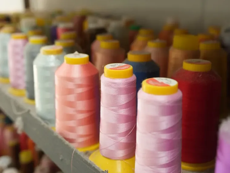 Thread and plush fabric preparation area inside the Dongguan factory