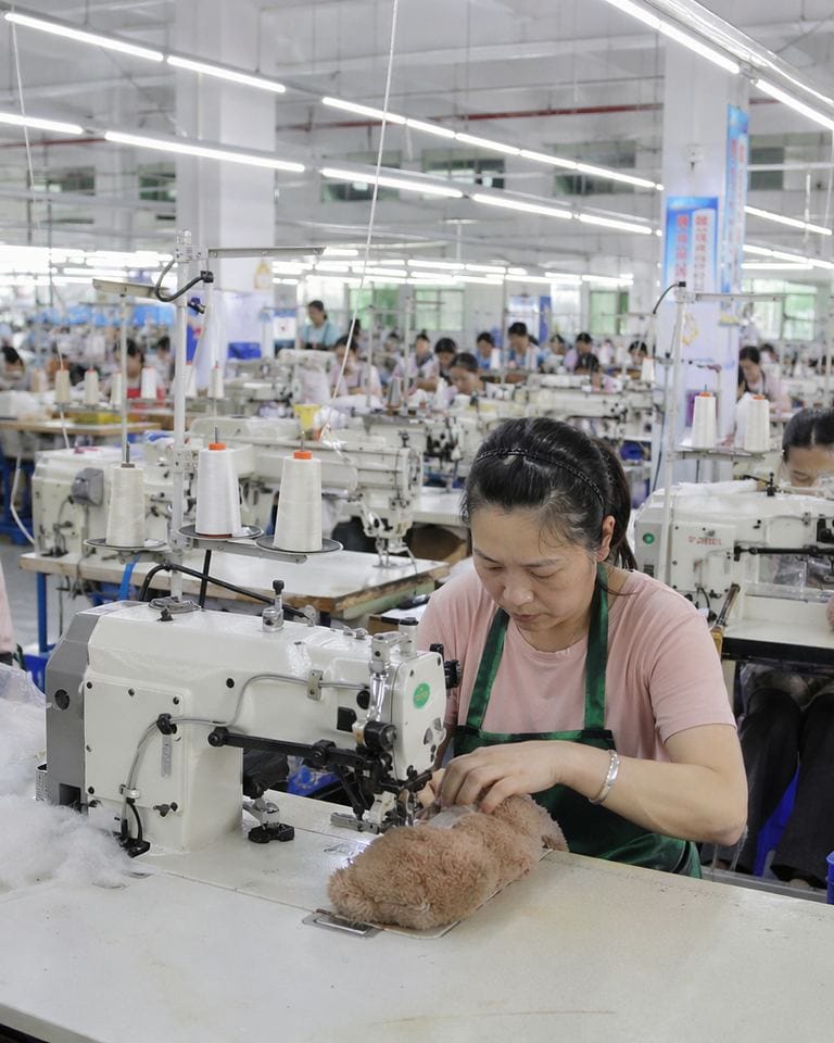Plush toy factory sewing line at the Dongguan manufacturing facility