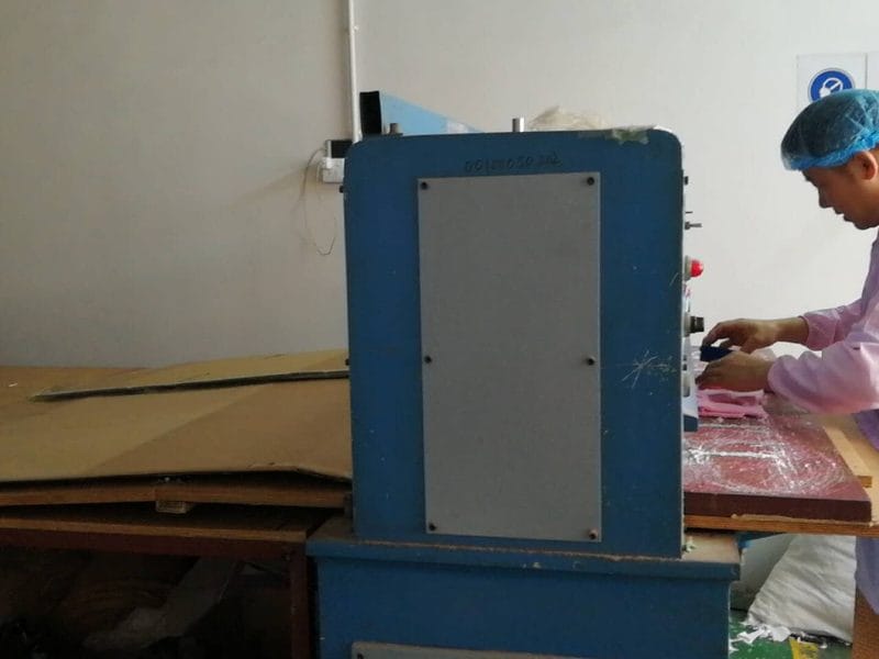 Fabric cutting equipment showing material use in plush production