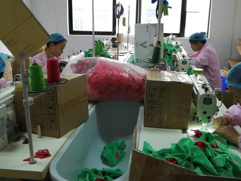 Sewing operators assembling custom plush shells